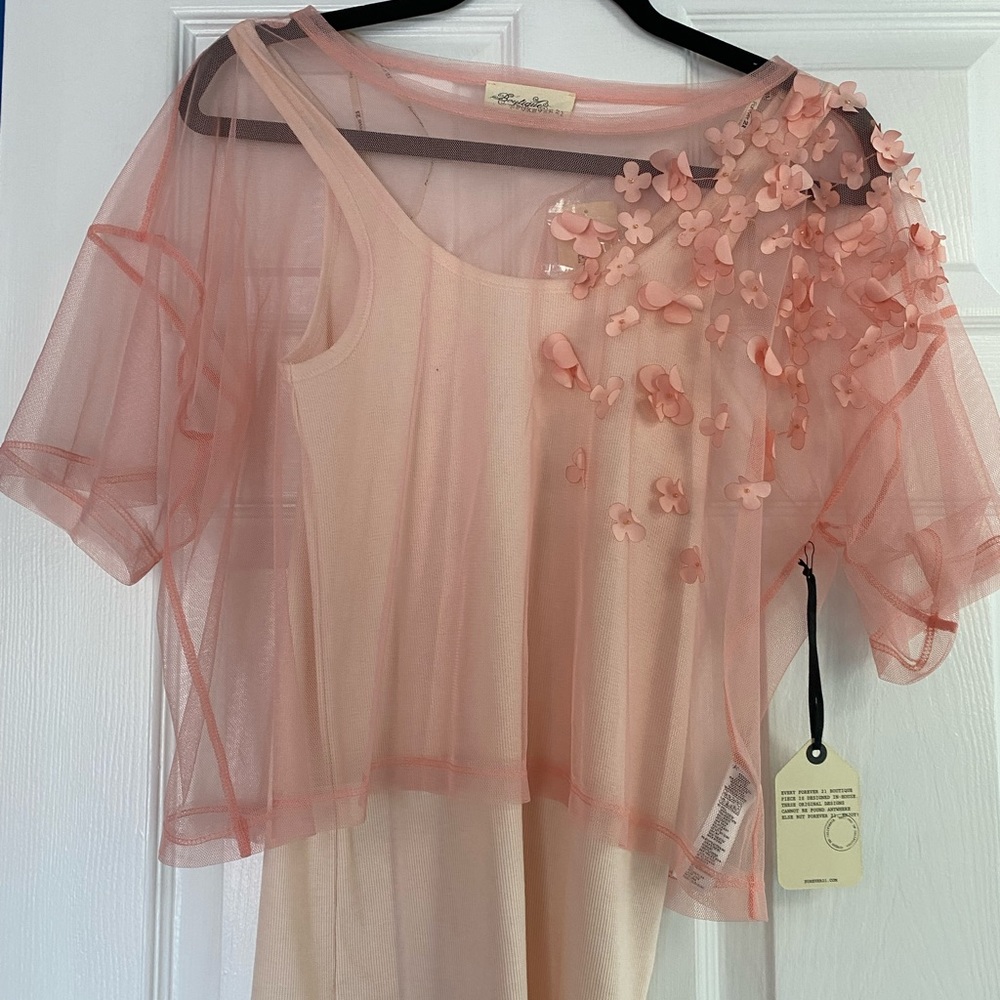 Lacy pink top over vanilla tank top with vanilla skirt.